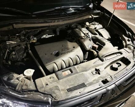 Черный Мицубиси Аутлендер, объемом двигателя 2.36 л и пробегом 226 тыс. км за 12499 $, фото 14 на Automoto.ua