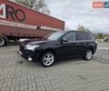 Черный Мицубиси Аутлендер, объемом двигателя 2.3 л и пробегом 233 тыс. км за 11600 $, фото 1 на Automoto.ua
