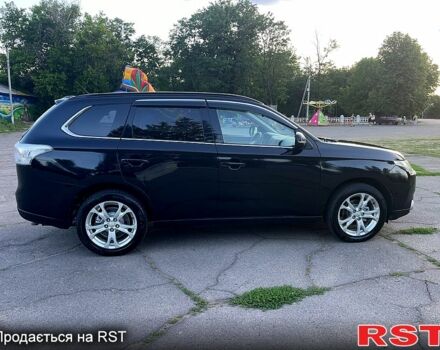 Черный Мицубиси Аутлендер, объемом двигателя 2.3 л и пробегом 219 тыс. км за 13600 $, фото 1 на Automoto.ua