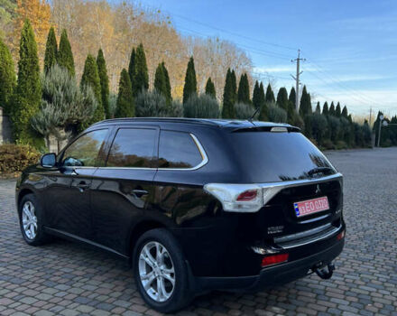 Черный Мицубиси Аутлендер, объемом двигателя 2 л и пробегом 190 тыс. км за 12500 $, фото 3 на Automoto.ua