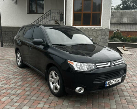 Черный Мицубиси Аутлендер, объемом двигателя 2.36 л и пробегом 70 тыс. км за 9000 $, фото 2 на Automoto.ua