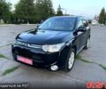 Черный Мицубиси Аутлендер, объемом двигателя 2.3 л и пробегом 219 тыс. км за 13600 $, фото 1 на Automoto.ua