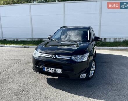 Черный Мицубиси Аутлендер, объемом двигателя 2 л и пробегом 270 тыс. км за 11400 $, фото 1 на Automoto.ua