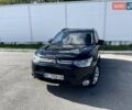 Черный Мицубиси Аутлендер, объемом двигателя 2 л и пробегом 270 тыс. км за 11400 $, фото 1 на Automoto.ua
