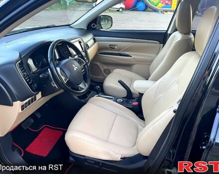 Черный Мицубиси Аутлендер, объемом двигателя 2.3 л и пробегом 219 тыс. км за 13600 $, фото 4 на Automoto.ua