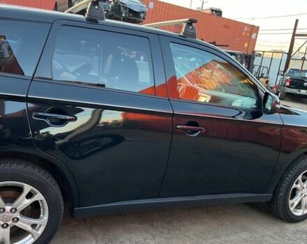 Черный Мицубиси Аутлендер, объемом двигателя 2.36 л и пробегом 226 тыс. км за 12499 $, фото 1 на Automoto.ua