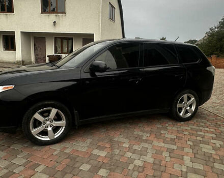 Черный Мицубиси Аутлендер, объемом двигателя 2.36 л и пробегом 70 тыс. км за 9000 $, фото 7 на Automoto.ua