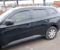 Черный Мицубиси Аутлендер, объемом двигателя 2.4 л и пробегом 120 тыс. км за 11300 $, фото 1 на Automoto.ua