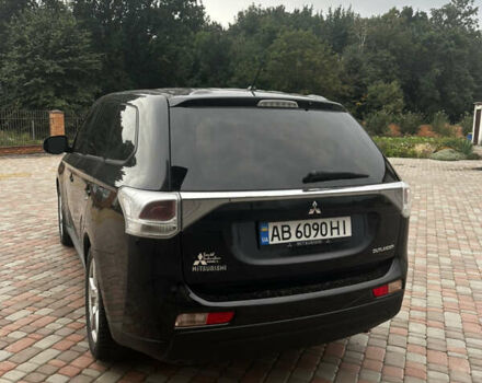 Черный Мицубиси Аутлендер, объемом двигателя 2.36 л и пробегом 70 тыс. км за 9000 $, фото 5 на Automoto.ua