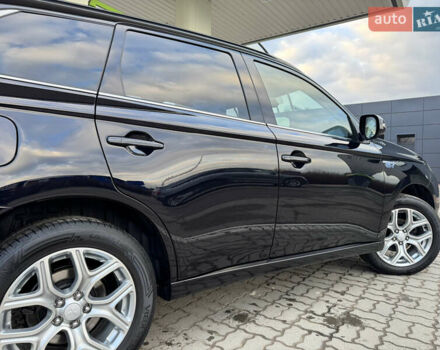 Чорний Міцубісі Аутлендер, об'ємом двигуна 2 л та пробігом 157 тис. км за 15299 $, фото 49 на Automoto.ua