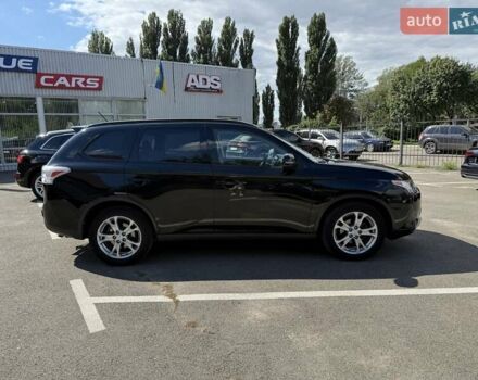 Черный Мицубиси Аутлендер, объемом двигателя 2.4 л и пробегом 231 тыс. км за 12600 $, фото 1 на Automoto.ua