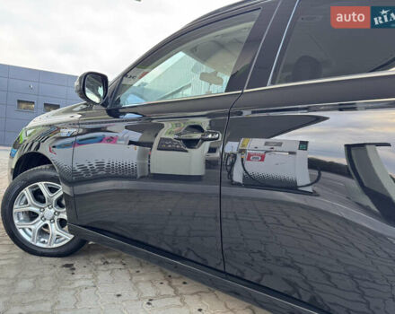 Чорний Міцубісі Аутлендер, об'ємом двигуна 2 л та пробігом 157 тис. км за 15299 $, фото 65 на Automoto.ua