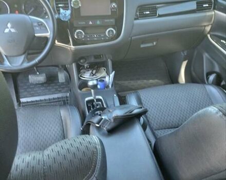 Черный Мицубиси Аутлендер, объемом двигателя 2.42 л и пробегом 148 тыс. км за 13000 $, фото 18 на Automoto.ua