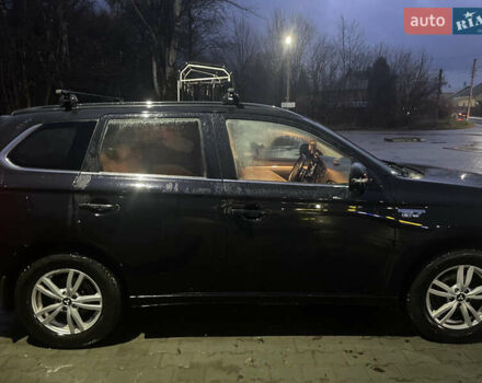 Черный Мицубиси Аутлендер, объемом двигателя 2 л и пробегом 206 тыс. км за 14500 $, фото 2 на Automoto.ua