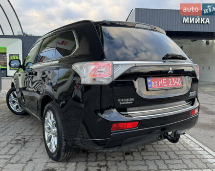 Чорний Міцубісі Аутлендер, об'ємом двигуна 2 л та пробігом 157 тис. км за 15299 $, фото 57 на Automoto.ua