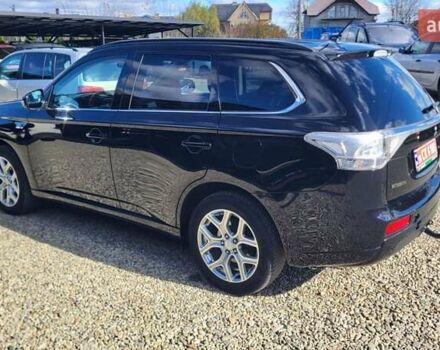 Чорний Міцубісі Аутлендер, об'ємом двигуна 2 л та пробігом 237 тис. км за 13800 $, фото 2 на Automoto.ua