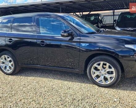 Чорний Міцубісі Аутлендер, об'ємом двигуна 2 л та пробігом 237 тис. км за 13800 $, фото 8 на Automoto.ua