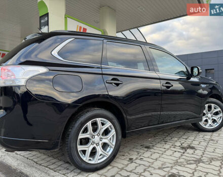 Чорний Міцубісі Аутлендер, об'ємом двигуна 2 л та пробігом 157 тис. км за 15299 $, фото 48 на Automoto.ua