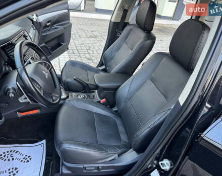 Чорний Міцубісі Аутлендер, об'ємом двигуна 2 л та пробігом 157 тис. км за 15299 $, фото 69 на Automoto.ua