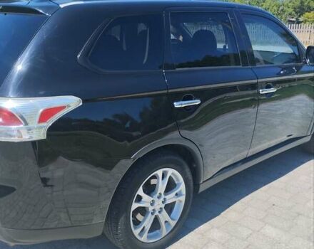 Черный Мицубиси Аутлендер, объемом двигателя 2.42 л и пробегом 148 тыс. км за 13000 $, фото 16 на Automoto.ua