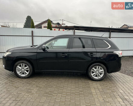 Черный Мицубиси Аутлендер, объемом двигателя 2 л и пробегом 223 тыс. км за 13400 $, фото 4 на Automoto.ua