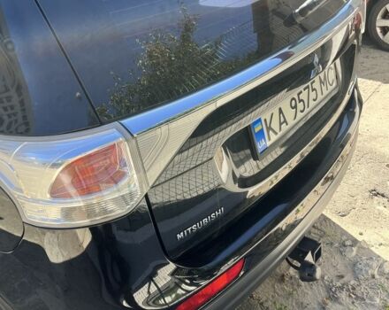 Черный Мицубиси Аутлендер, объемом двигателя 2 л и пробегом 150 тыс. км за 12000 $, фото 1 на Automoto.ua
