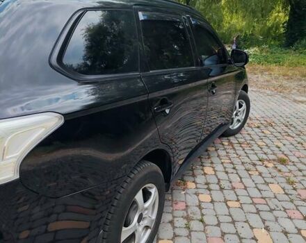 Чорний Міцубісі Аутлендер, об'ємом двигуна 2.36 л та пробігом 275 тис. км за 11700 $, фото 6 на Automoto.ua