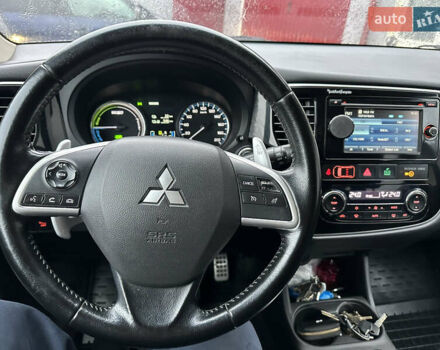 Черный Мицубиси Аутлендер, объемом двигателя 2 л и пробегом 223 тыс. км за 13400 $, фото 18 на Automoto.ua