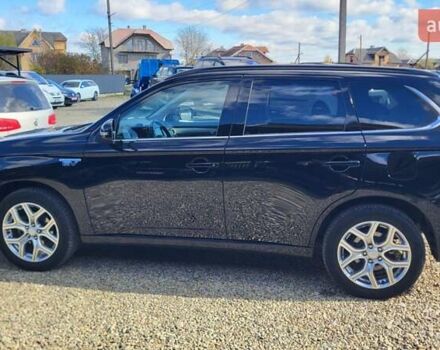 Чорний Міцубісі Аутлендер, об'ємом двигуна 2 л та пробігом 237 тис. км за 13800 $, фото 1 на Automoto.ua