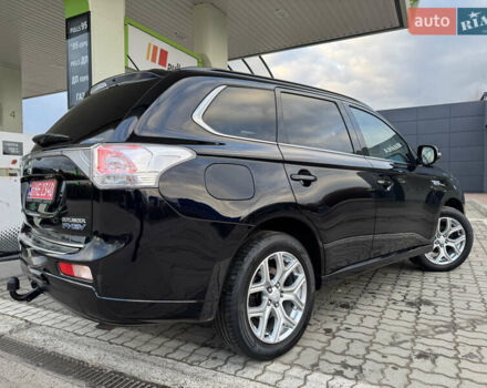 Чорний Міцубісі Аутлендер, об'ємом двигуна 2 л та пробігом 157 тис. км за 15299 $, фото 47 на Automoto.ua