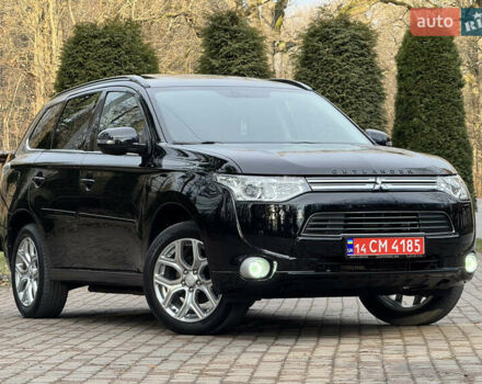 Черный Мицубиси Аутлендер, объемом двигателя 2 л и пробегом 173 тыс. км за 15299 $, фото 1 на Automoto.ua
