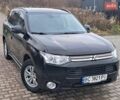 Чорний Міцубісі Аутлендер, об'ємом двигуна 2 л та пробігом 170 тис. км за 12990 $, фото 1 на Automoto.ua