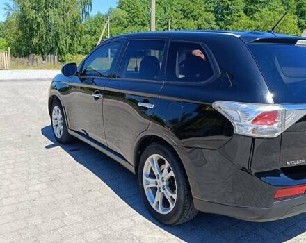 Черный Мицубиси Аутлендер, объемом двигателя 2.42 л и пробегом 148 тыс. км за 13000 $, фото 5 на Automoto.ua