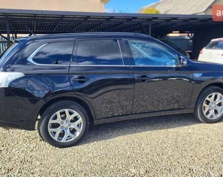 Чорний Міцубісі Аутлендер, об'ємом двигуна 2 л та пробігом 237 тис. км за 13800 $, фото 7 на Automoto.ua