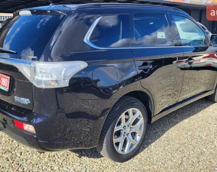 Чорний Міцубісі Аутлендер, об'ємом двигуна 2 л та пробігом 237 тис. км за 13800 $, фото 6 на Automoto.ua