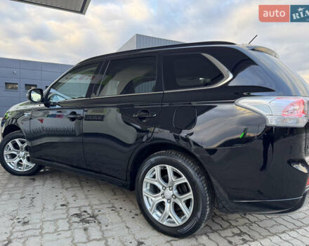Чорний Міцубісі Аутлендер, об'ємом двигуна 2 л та пробігом 157 тис. км за 15299 $, фото 63 на Automoto.ua