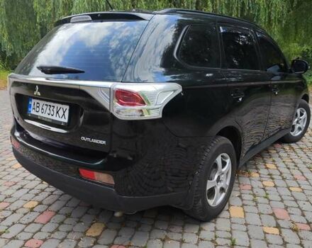 Чорний Міцубісі Аутлендер, об'ємом двигуна 2.36 л та пробігом 275 тис. км за 11700 $, фото 7 на Automoto.ua