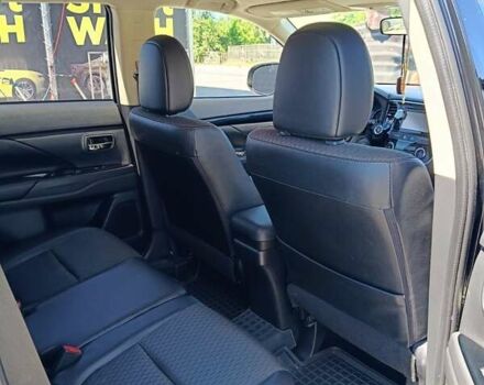 Черный Мицубиси Аутлендер, объемом двигателя 2.42 л и пробегом 148 тыс. км за 13000 $, фото 3 на Automoto.ua