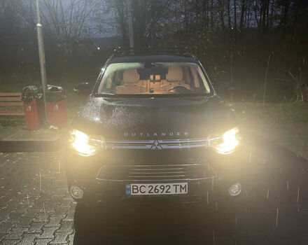 Черный Мицубиси Аутлендер, объемом двигателя 2 л и пробегом 206 тыс. км за 14500 $, фото 1 на Automoto.ua