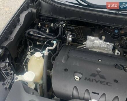 Чорний Міцубісі Аутлендер, об'ємом двигуна 2 л та пробігом 250 тис. км за 10800 $, фото 21 на Automoto.ua