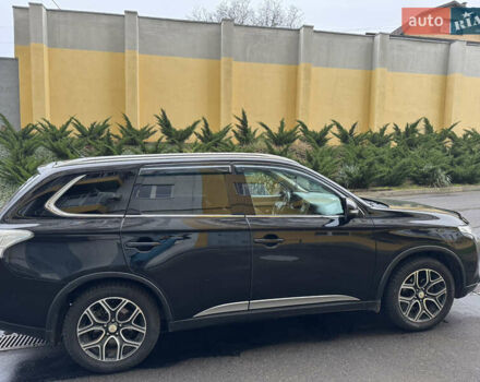 Черный Мицубиси Аутлендер, объемом двигателя 2.27 л и пробегом 244 тыс. км за 14000 $, фото 1 на Automoto.ua