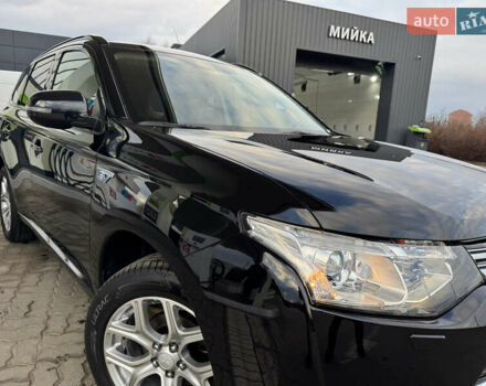 Чорний Міцубісі Аутлендер, об'ємом двигуна 2 л та пробігом 157 тис. км за 15299 $, фото 12 на Automoto.ua