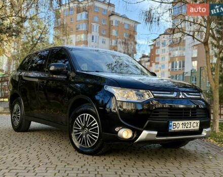 Черный Мицубиси Аутлендер, объемом двигателя 2.4 л и пробегом 270 тыс. км за 12500 $, фото 1 на Automoto.ua