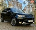 Черный Мицубиси Аутлендер, объемом двигателя 2.4 л и пробегом 270 тыс. км за 12500 $, фото 1 на Automoto.ua