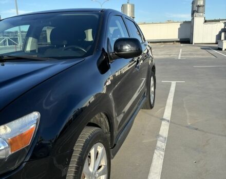 Черный Мицубиси Аутлендер, объемом двигателя 2 л и пробегом 105 тыс. км за 9999 $, фото 1 на Automoto.ua