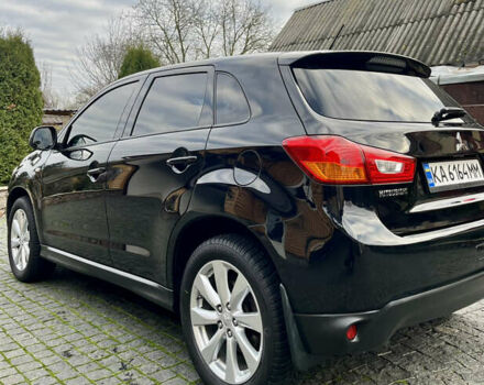 Чорний Міцубісі Аутлендер, об'ємом двигуна 2 л та пробігом 170 тис. км за 10999 $, фото 12 на Automoto.ua