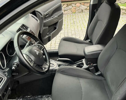 Чорний Міцубісі Аутлендер, об'ємом двигуна 2 л та пробігом 170 тис. км за 10999 $, фото 20 на Automoto.ua