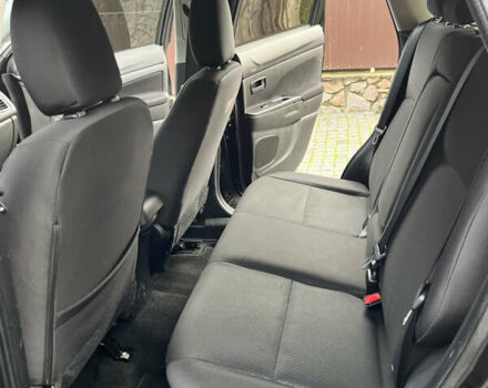 Чорний Міцубісі Аутлендер, об'ємом двигуна 2 л та пробігом 170 тис. км за 10999 $, фото 24 на Automoto.ua