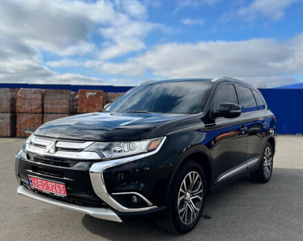 Черный Мицубиси Аутлендер, объемом двигателя 2.36 л и пробегом 91 тыс. км за 15500 $, фото 1 на Automoto.ua