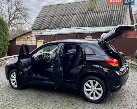 Чорний Міцубісі Аутлендер, об'ємом двигуна 2 л та пробігом 170 тис. км за 10999 $, фото 18 на Automoto.ua